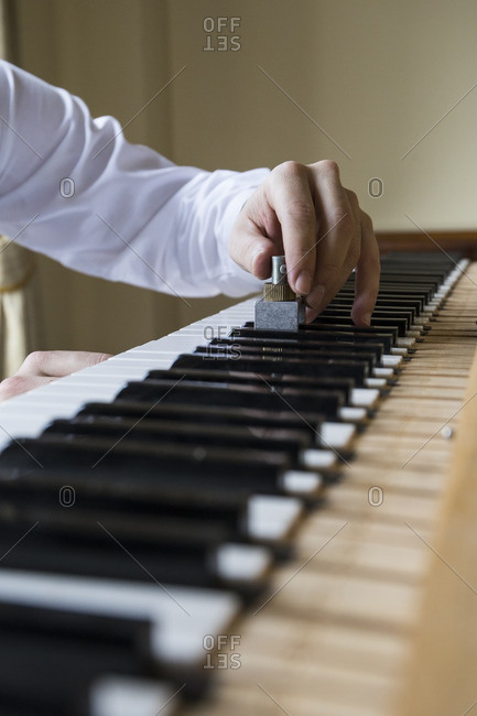 Piano tuner tuning grand piano