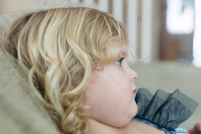 Side View Of A Little Girl With Blonde Curly Hair Stock Photo Offset