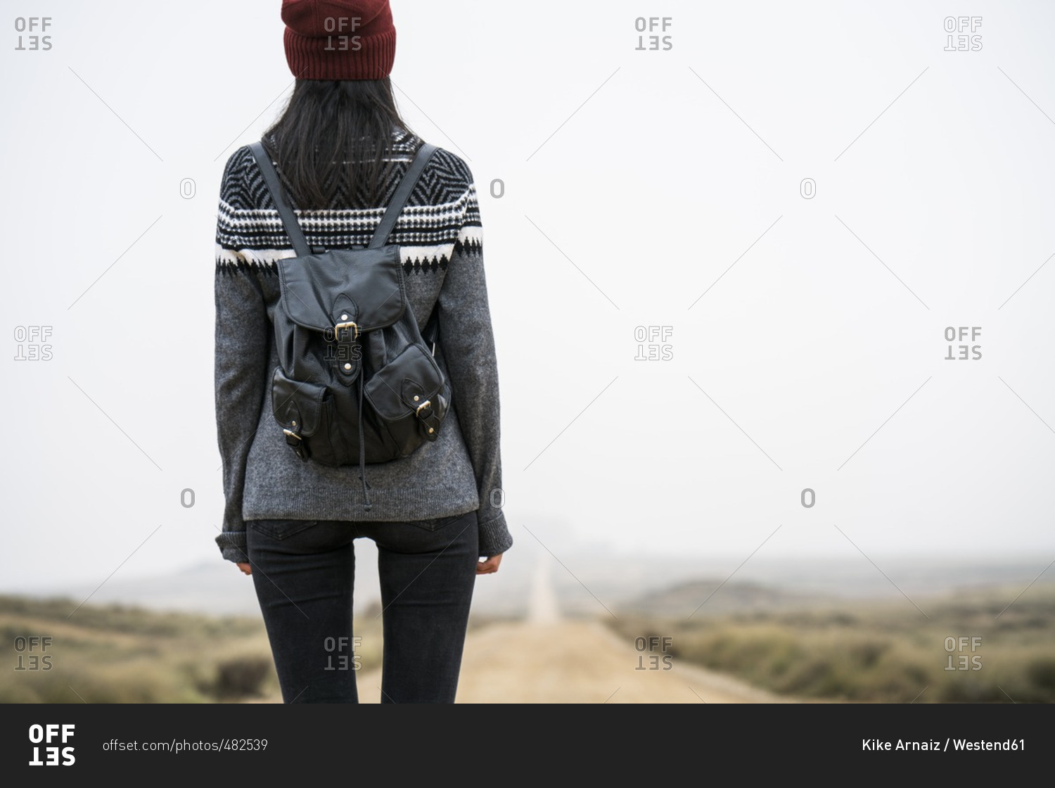 Spain- Navarra- Bardenas Reales- back view of young woman standing in nature park