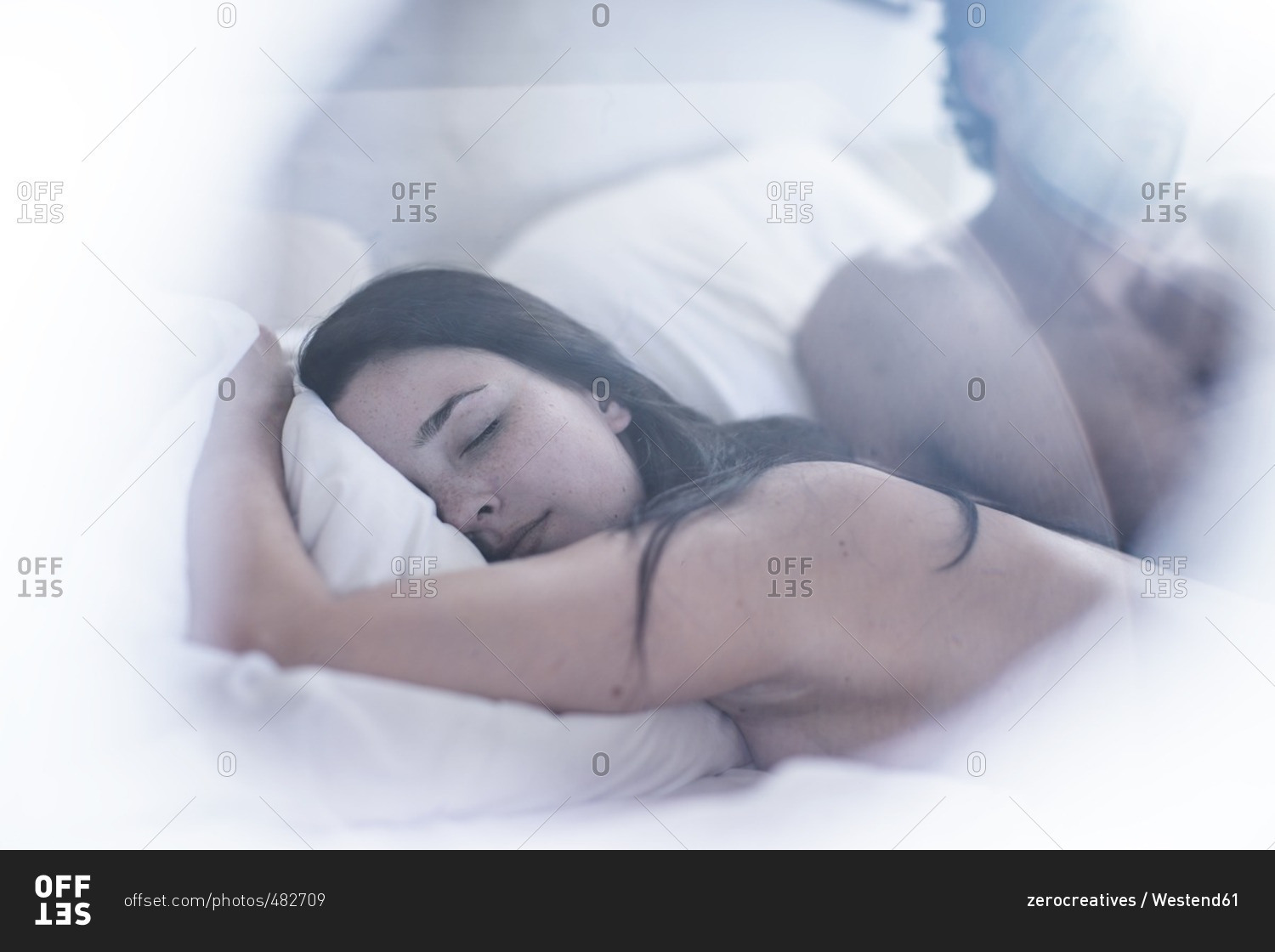 man and woman sleeping in bed stock photos - OFFSET