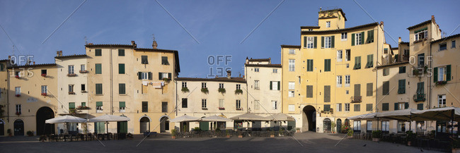 Buildings inside the Piazza Anfiteatro which was built inside a Roman amphitheater, Lucca, Italy