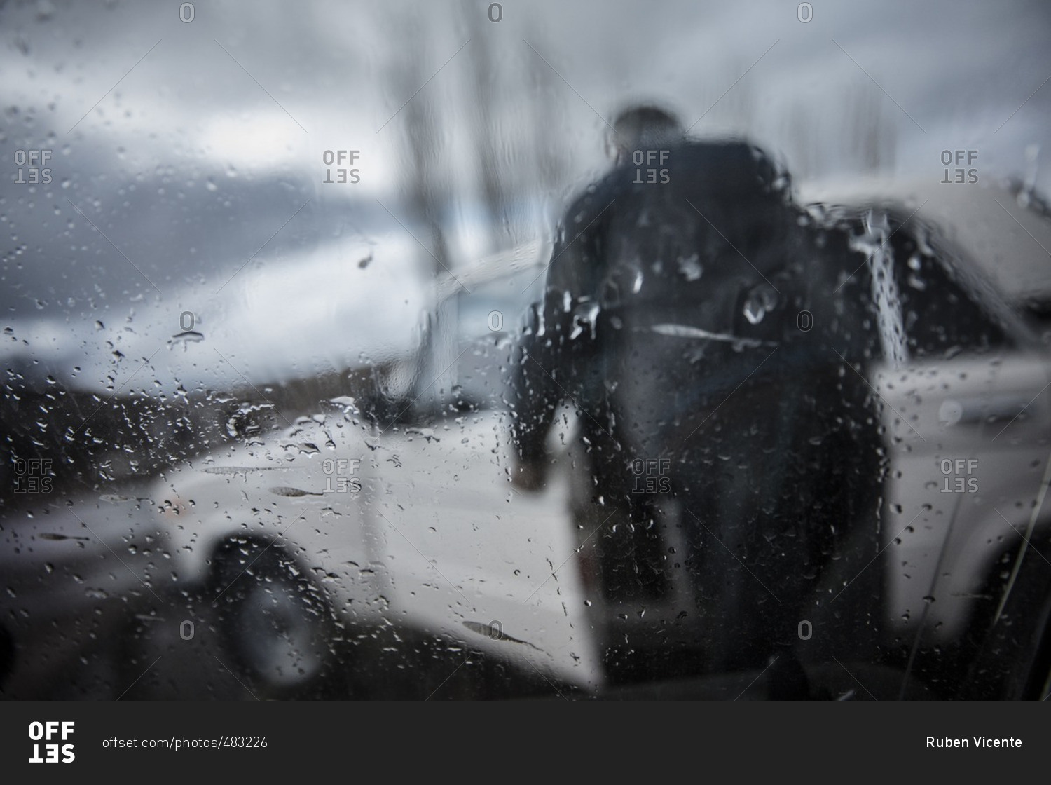 A man at Zovasar entering his car in the rain, Armenia