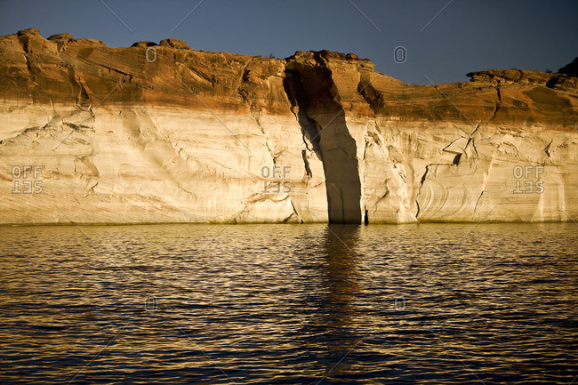 Sedimentary rock formations surrounding a canyon lake