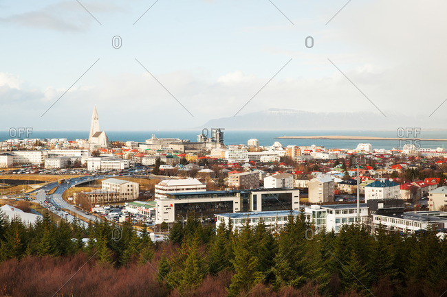 Reykjavik, Iceland - February 28, 2012: City skyline with colorful rooftops and distant mountains