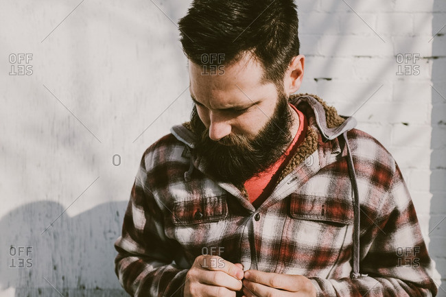 Man with beard in a flannel shirt