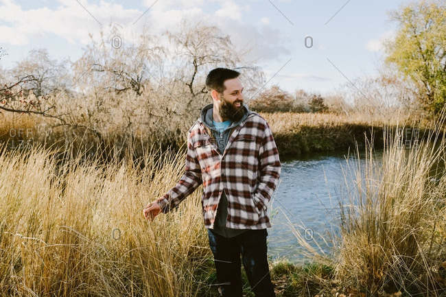 Man in flannel in a rural setting