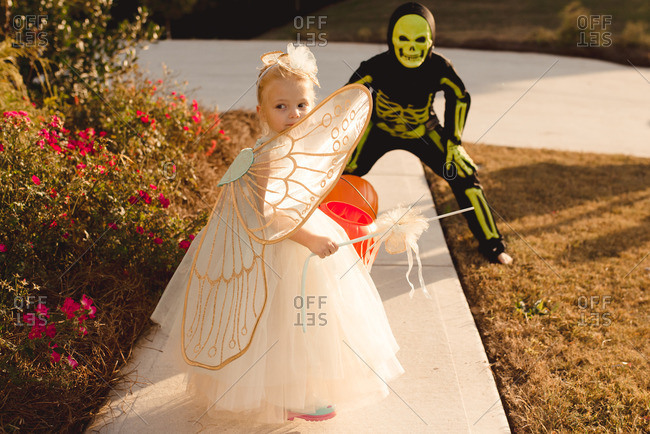 Children dressed as a fairy and skeleton for Halloween