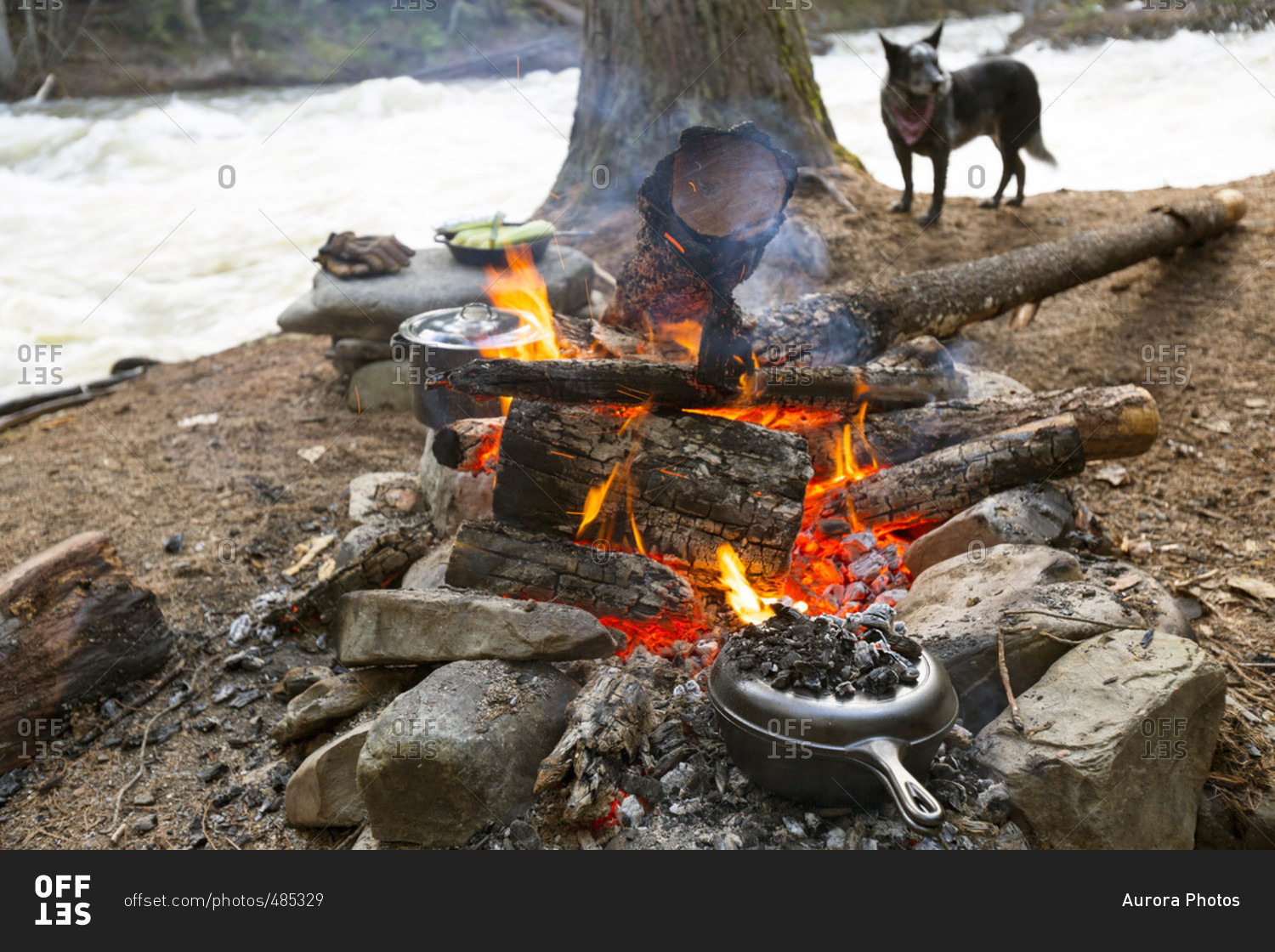 Food Is Prepared In Cast Iron Cooking Vessels Over A Hot Campfire