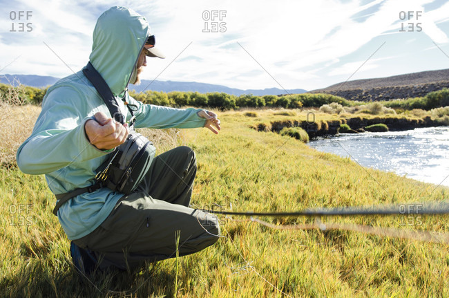 Fisherman Prepares His Fly Before Fly Fishing On The Owens River, Bishop, California
