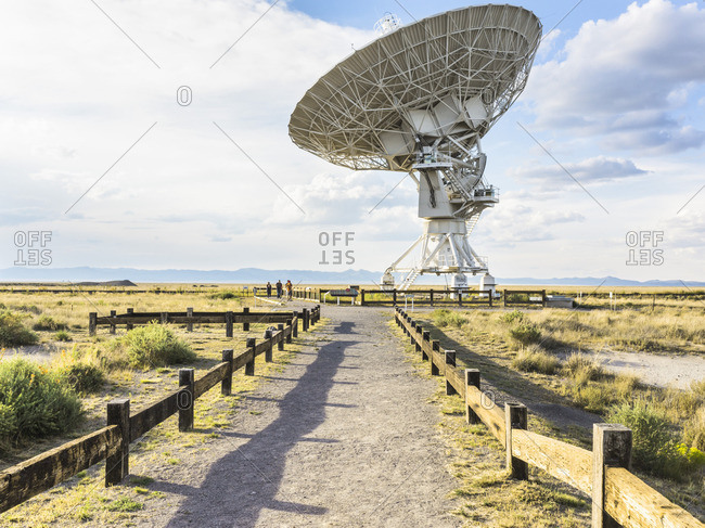Socorro, New Mexico - August 24, 2016: People on path looking at telescope, Karl G. Jansky Very Large Array