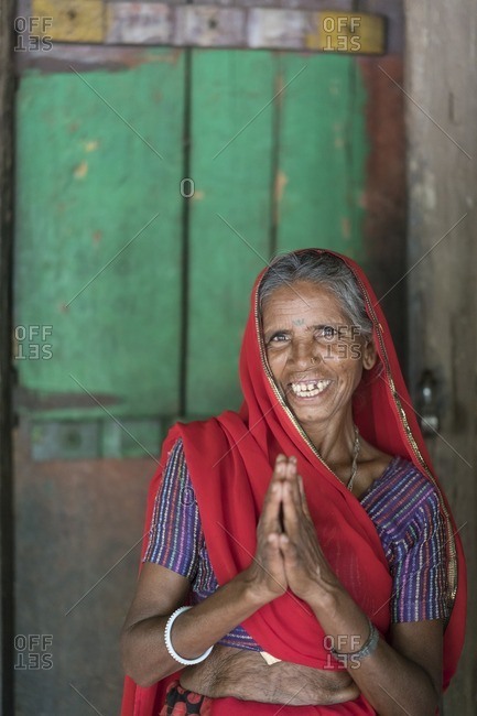 Udaipur, India - June 29, 2016: Elderly woman offers a Namaste greeting in Udaipur, India