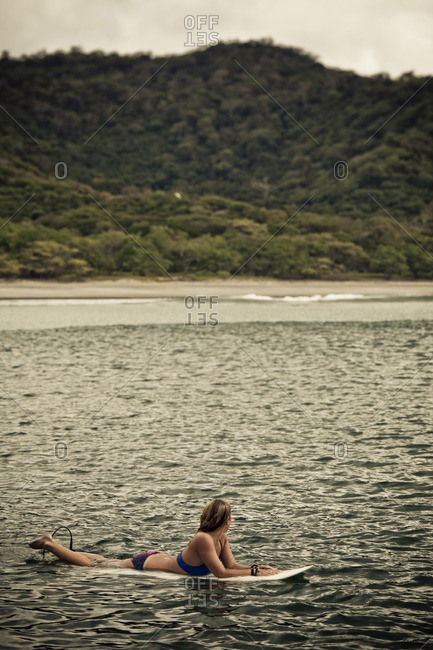 A female surfer takes in the beauty of San Juan del Sur, Nicaragua