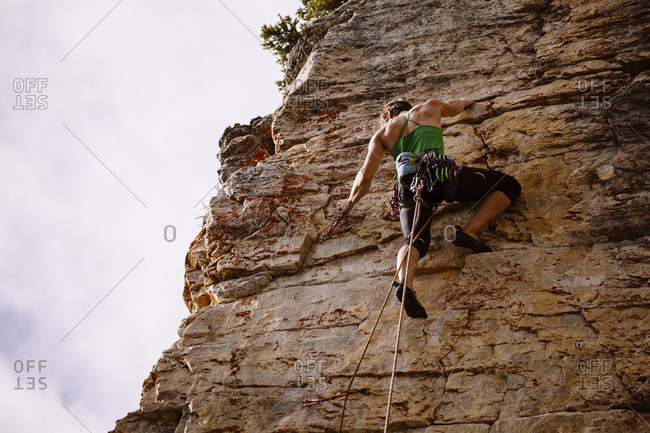 Man & woman sort rock climbing gear during early morning in mountains stock  photo