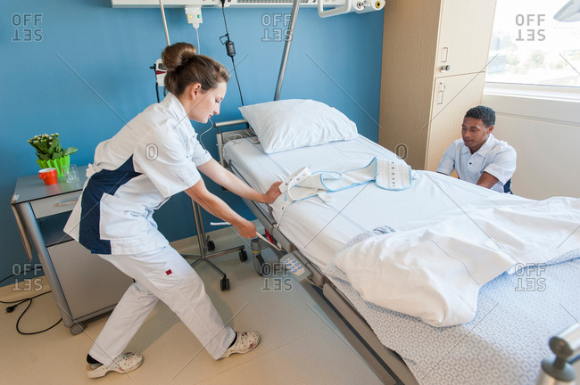 hospital-orderlies-adjusting-hospital-bed-stock-photo-offset