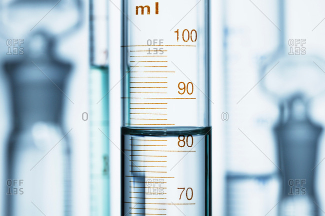 Meniscus. Curved surface (meniscus) of water in graduated cylinder. Liquid volume measured by reading the scale at the bottom of the meniscus. The reading is 82.6 mL