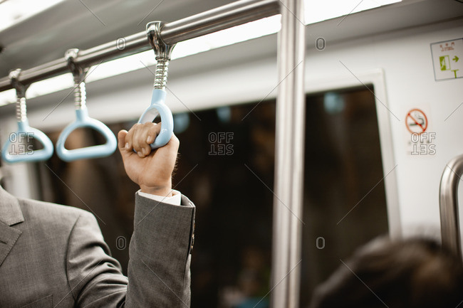 Commuters on a subway train.