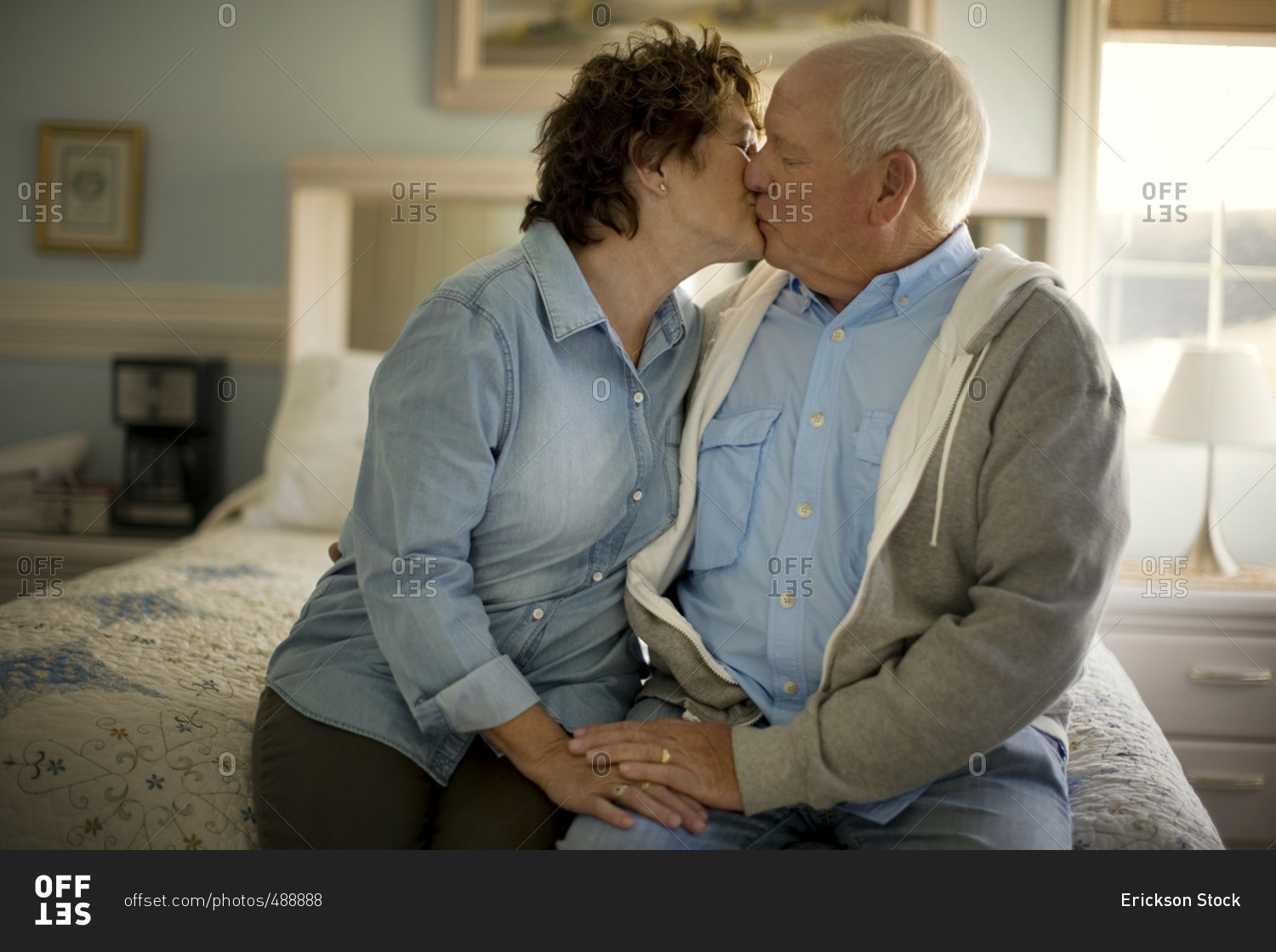 Senior couple sharing a kiss. 