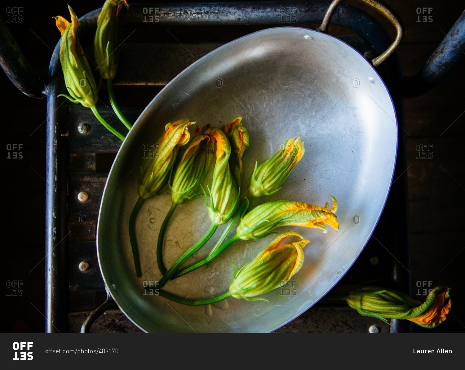 Squash blossoms in roasting pan
