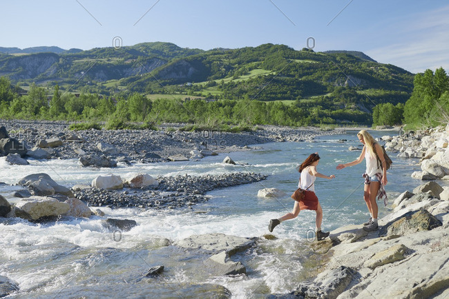 Brave girl friends cross river on adventure