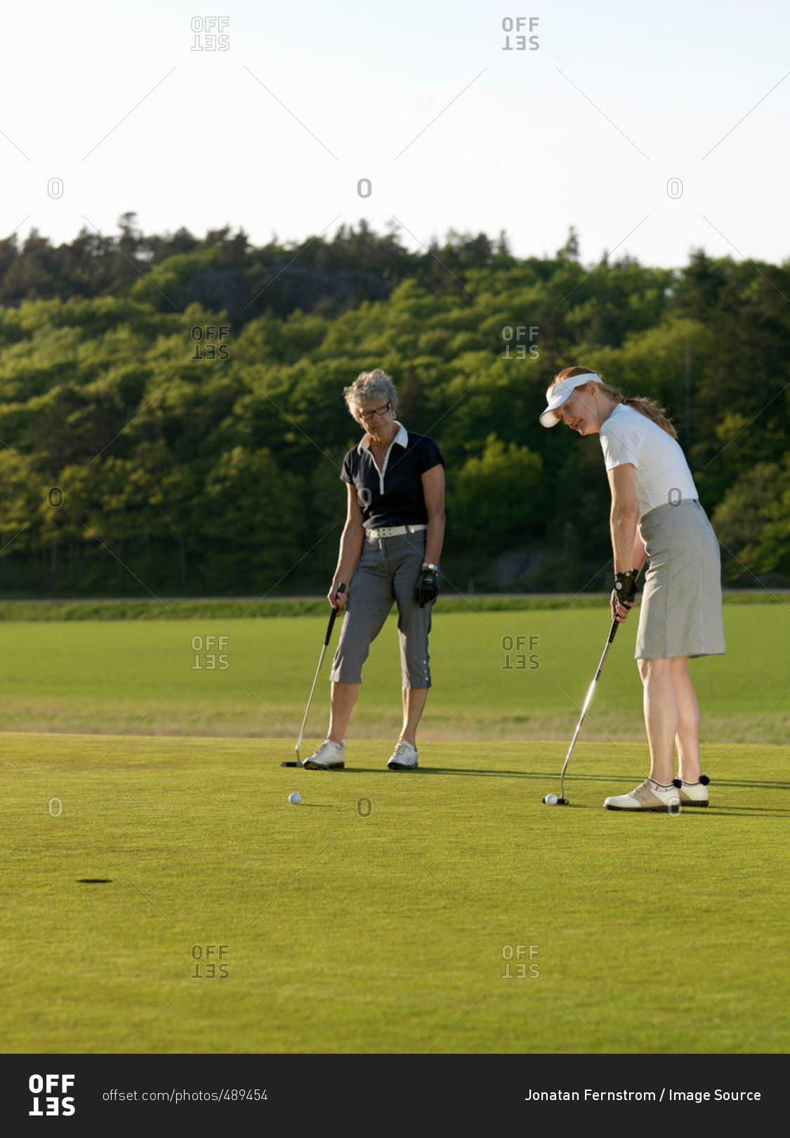 Two women at golf green