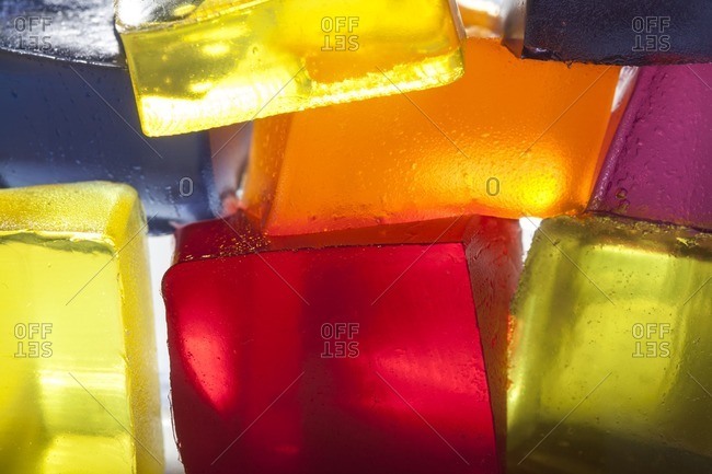 Translucent blocks of stacked, colored gelatin lit from behind