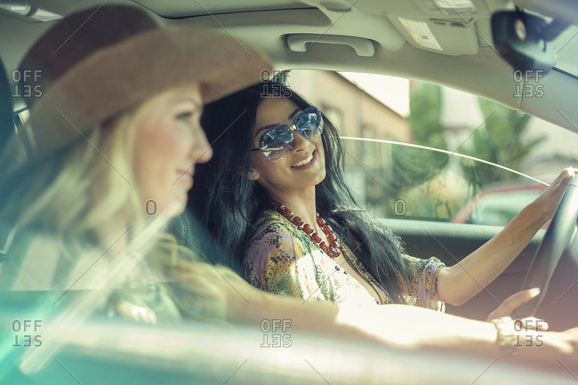Two female friends on car journey together