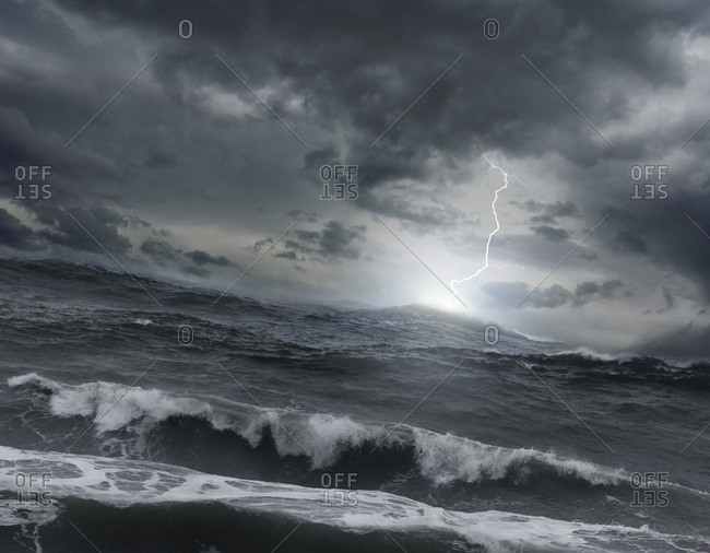 Lightning striking ocean water