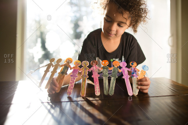 Girl making popsicle stick art