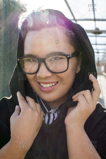 Portrait of smiling androgynous Asian woman