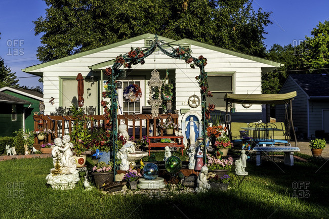 Yankton, South Dakota, USA - July 8, 2016: Display of statuary in front yard of house