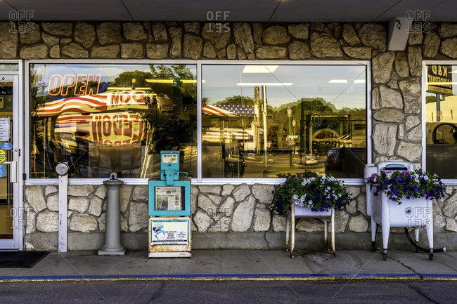 Yankton, South Dakota, USA - July 8, 2016: Exterior of Laundromat with American flag reflected in window