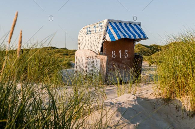 Germany- Amrum- locked hooded beach chair in dunes