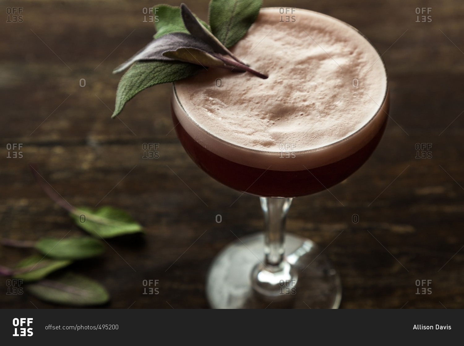 Frothy pomegranate and sage cocktail