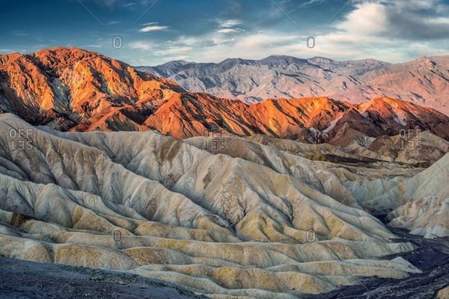 Sun setting over the eroded mountains of Zabriskie Point, Death Valley