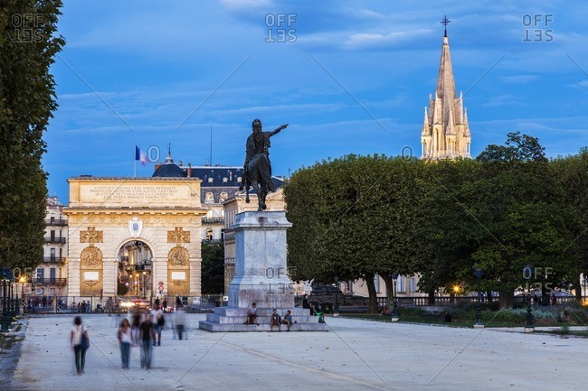Porte du Peyrou, Occitanie, France - April 5, 2011: France, Occitanie, Montpellier, Porte du Peyrou and St. Anne Church at dusk