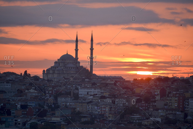 The Mihrimah Sultan Mosque overlooking the city at dusk in Istanbul, Turkey
