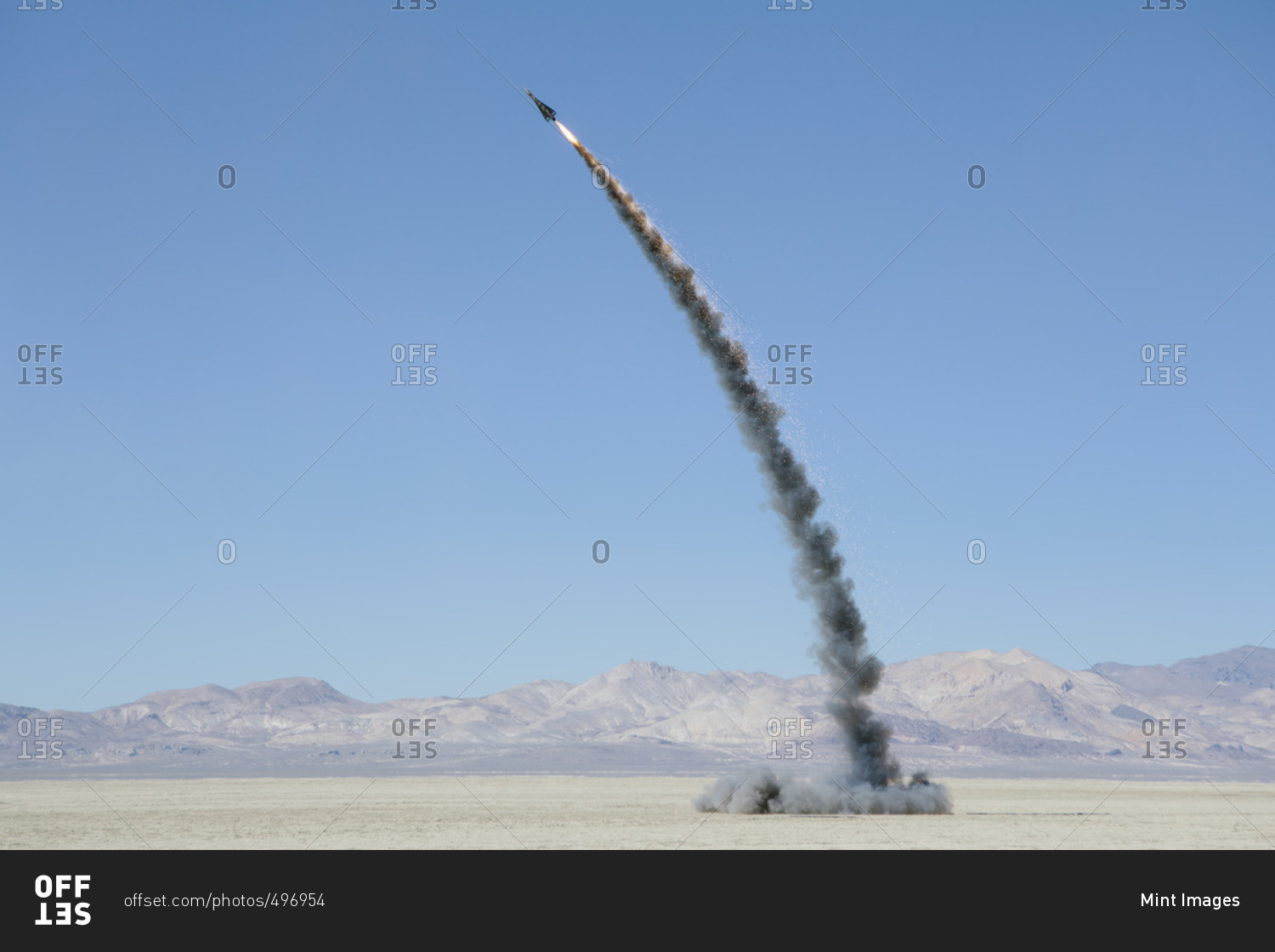 Rocket shooting into vast, desert sky, Black Rock Desert, Nevada