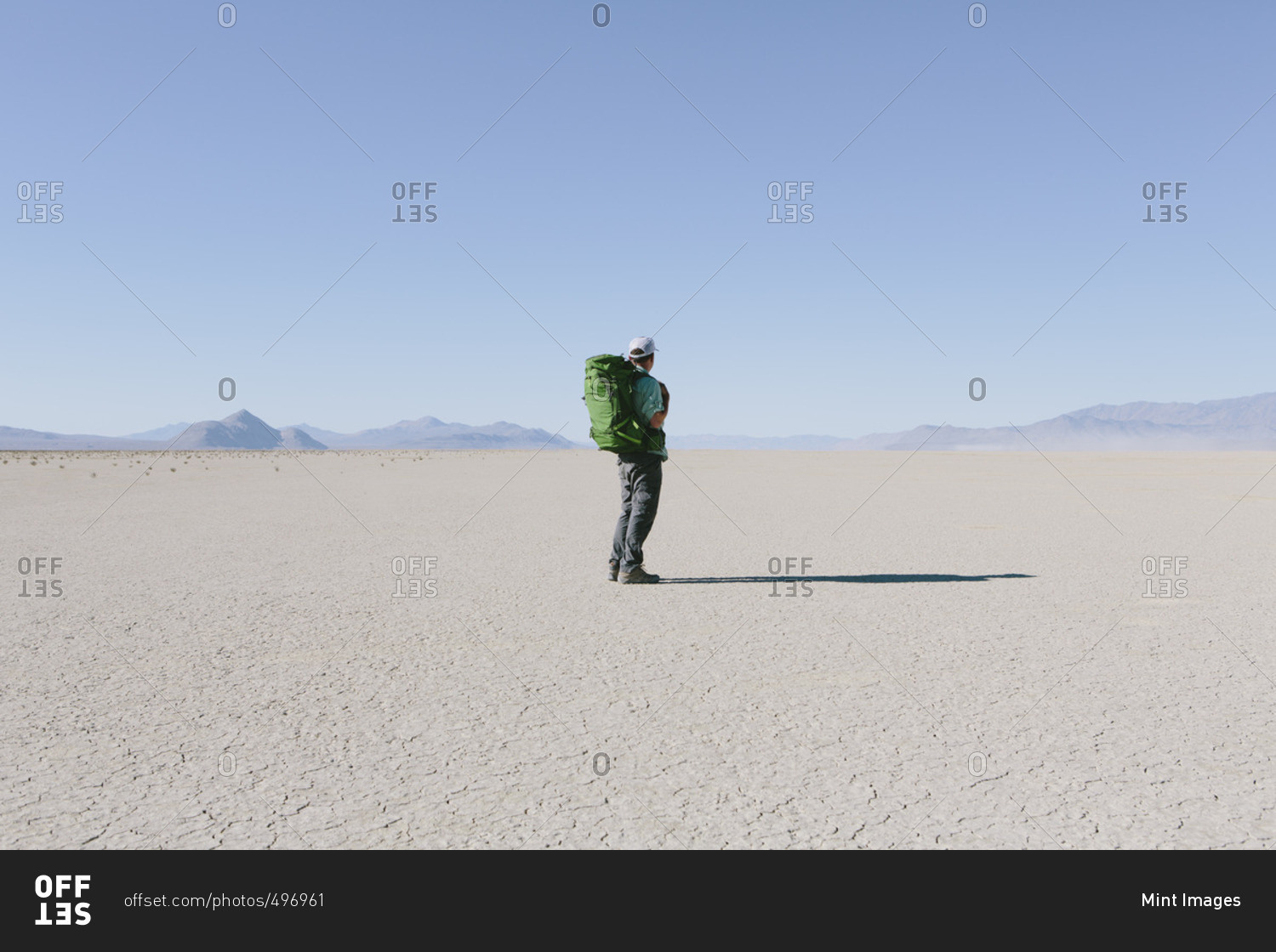 Male backpacker hiking in vast desert, Black Rock Desert, Nevada