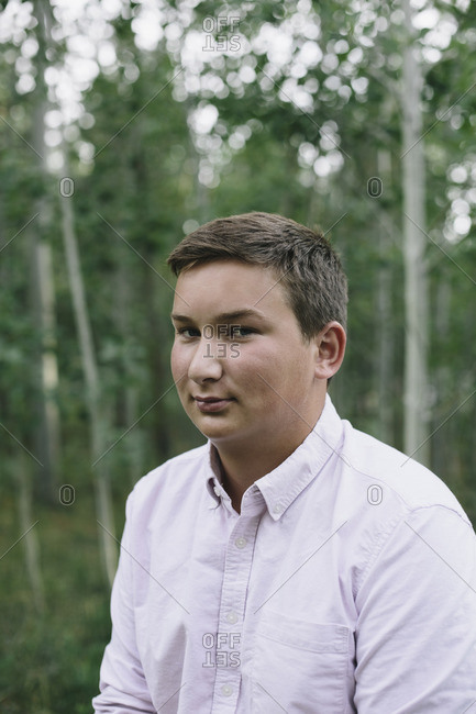 Portrait of moody teenage boy outdoors