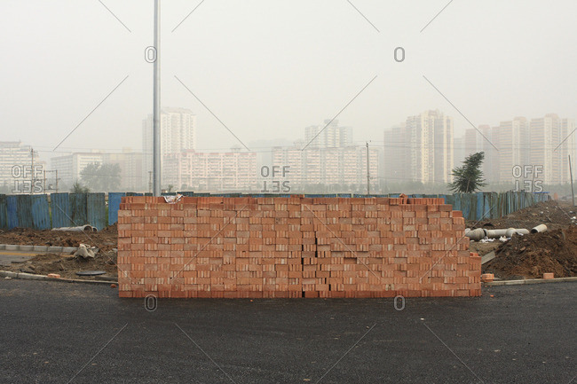 China, Beijing, Pile of bricks constituted by bricks collected by women in a destroyed hutong
