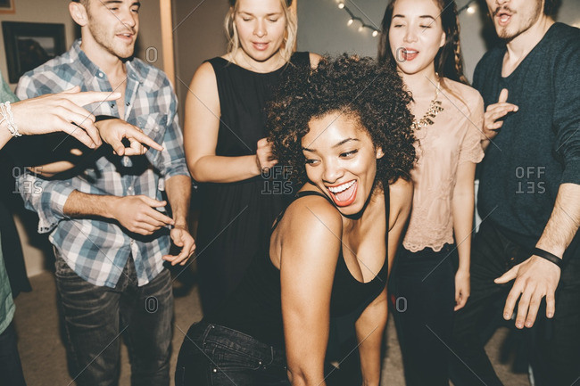 people dancing at a house party