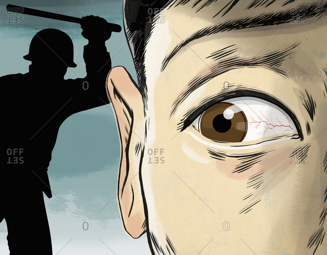 Scared young man with man holding baton in background