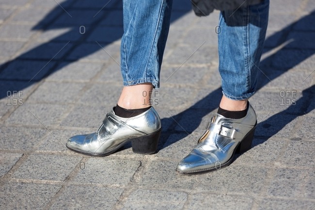 Woman wearing silver booties