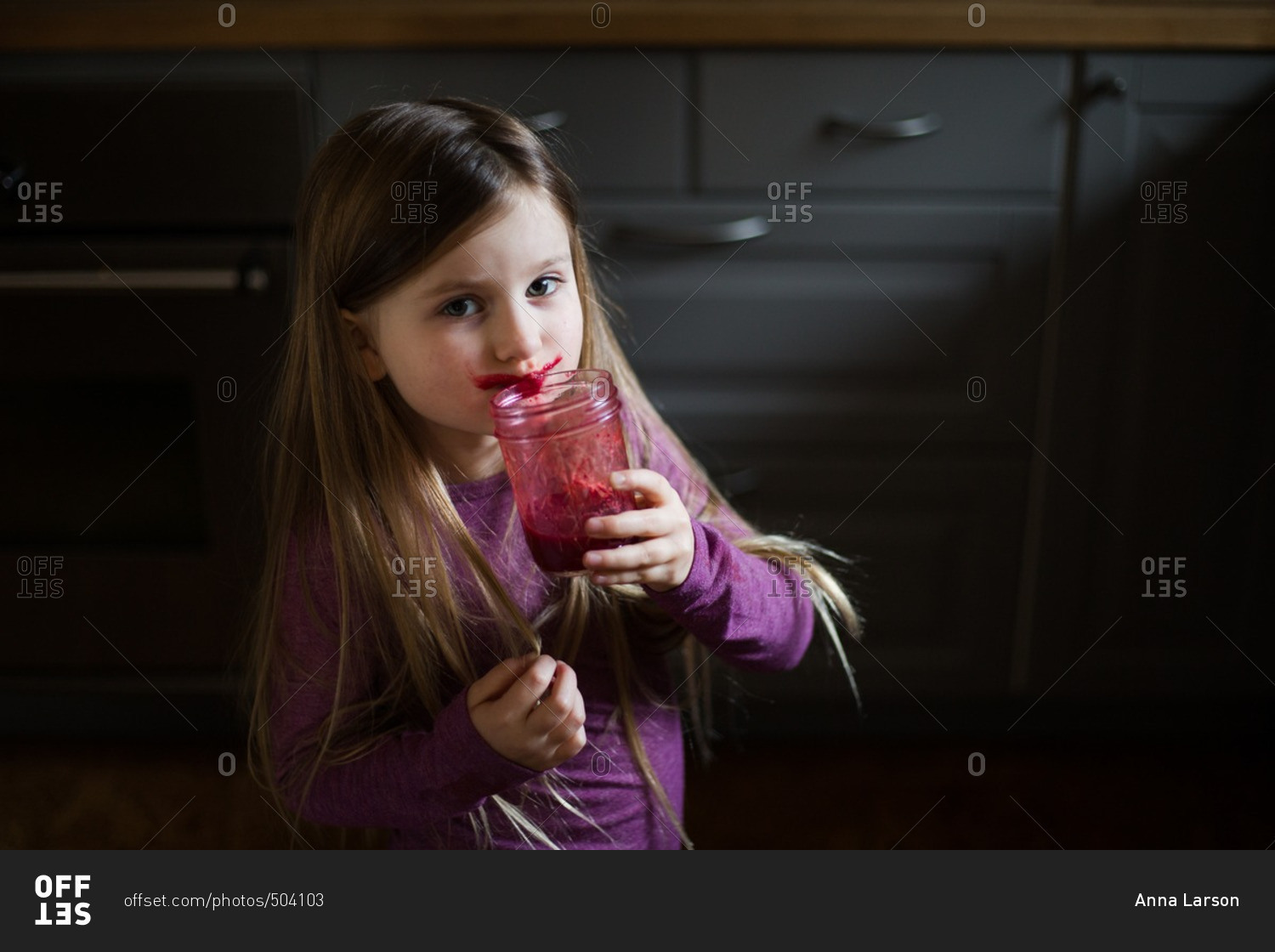 Girl drinking juice from jar