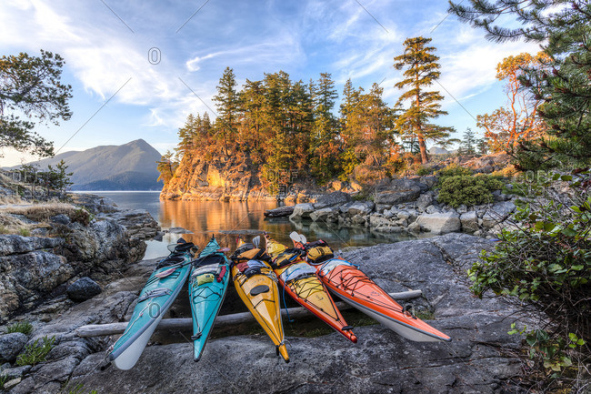 Desolation Sound Marine Park, British Columbia, Canada. - June 15, 2015: Kayaks rest just above the high tide mark on West Curme Island