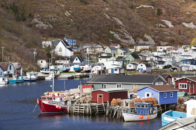 Petty Harbor, Newfoundland, Canada - June 13, 2014: Nestled deep in the heart of Motion Bay, Petty Harbor is a small town south of St John's that still relies heavily on fishing as it makes the transition to tourism-related services