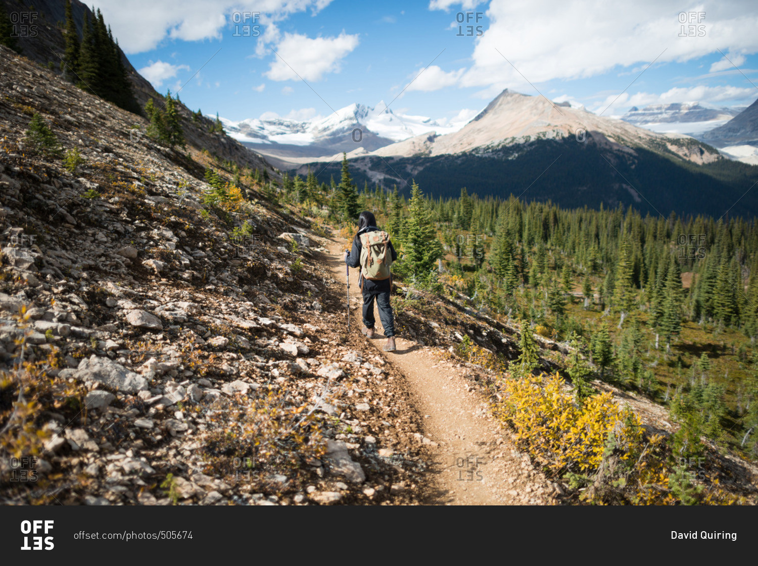 Female hiking along mountain ridge in the Rockies