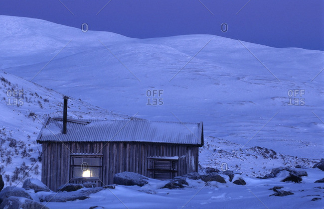 Remote Log Cabin At Dusk Stock Photo Offset