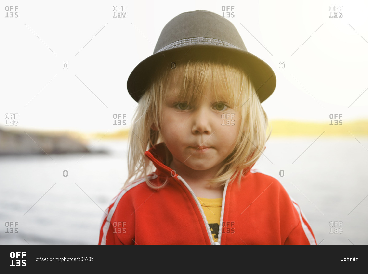 Portrait of young boy wearing hat stock photo OFFSET