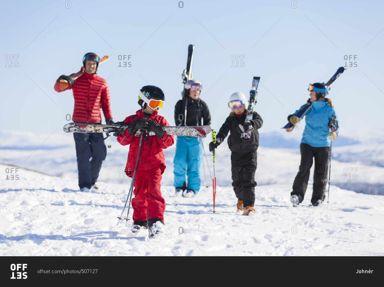Father with children skiing